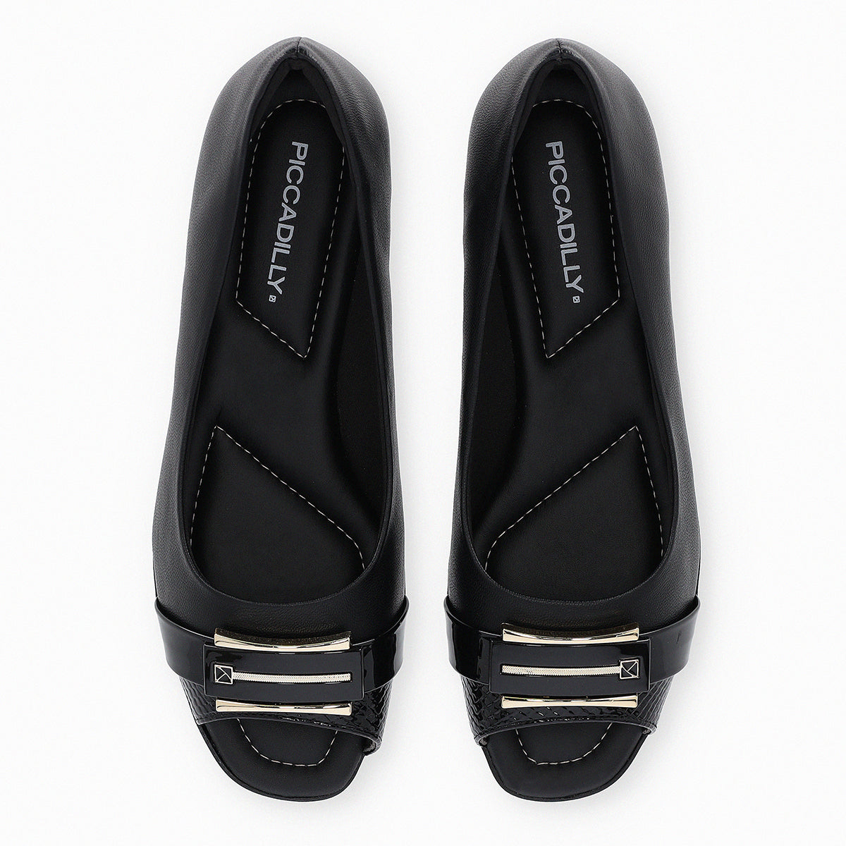 Piccadilly flat shoe with low heel, black color, featuring a buckle with gold and black patent details.