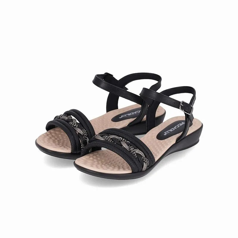 Low Piccadilly sandal, black color with beige sole, adjustable buckle with straps on the upper part and shiny braided details.
