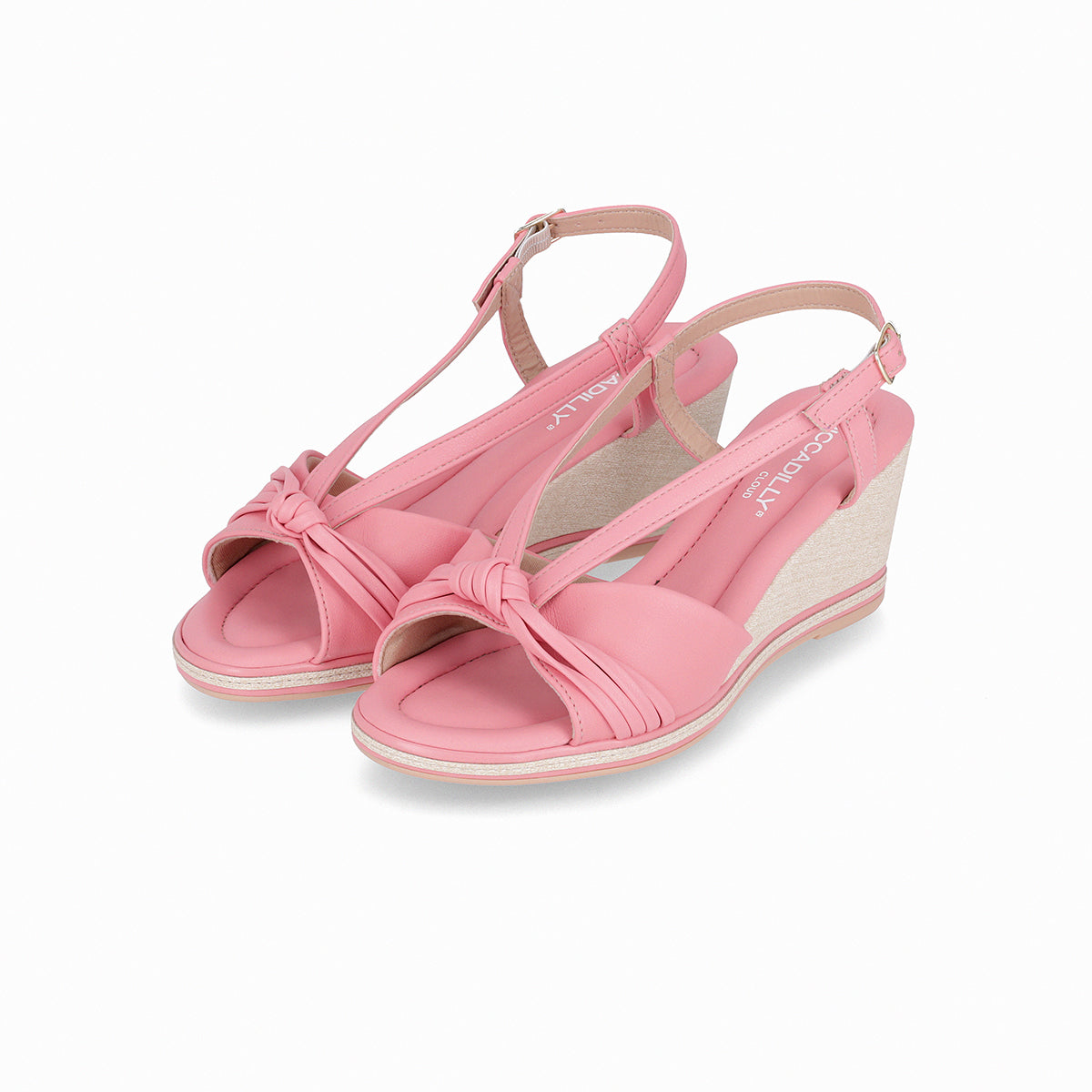 Pink wedges sandal by Piccadilly, featuring an adjustable strap with a gold side buckle, front knot detail, and a sole with white and pink stripes.