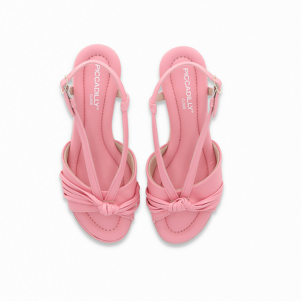 Pink wedges sandal by Piccadilly, featuring an adjustable strap with a gold side buckle, front knot detail, and a sole with white and pink stripes.