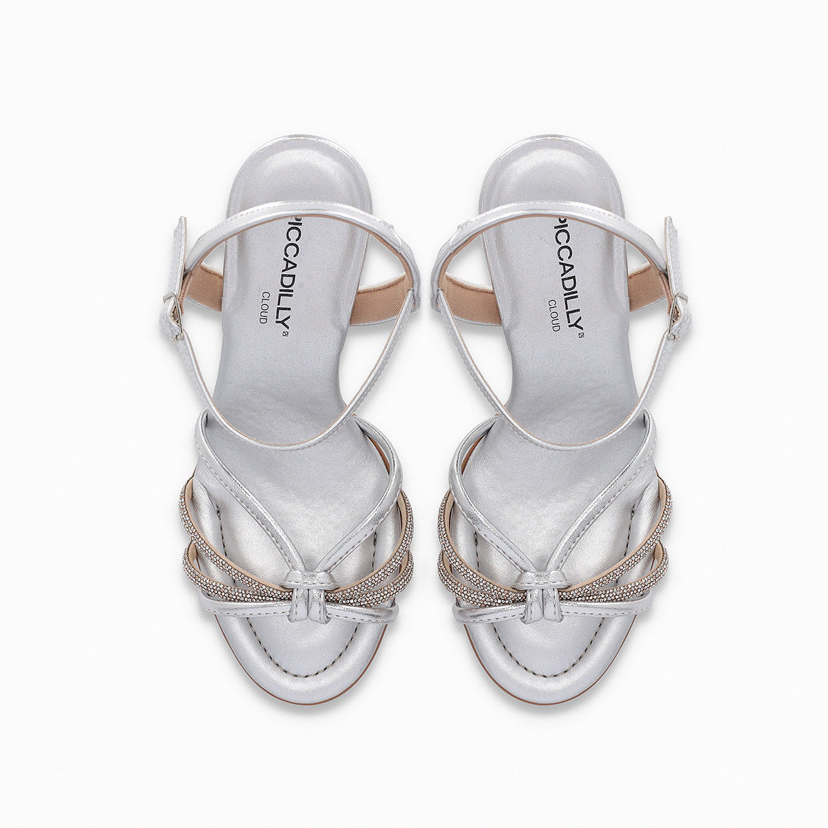 High heel Piccadilly sandal, silver color with adjustable buckle, upper straps featuring a rhinestone knot detail.