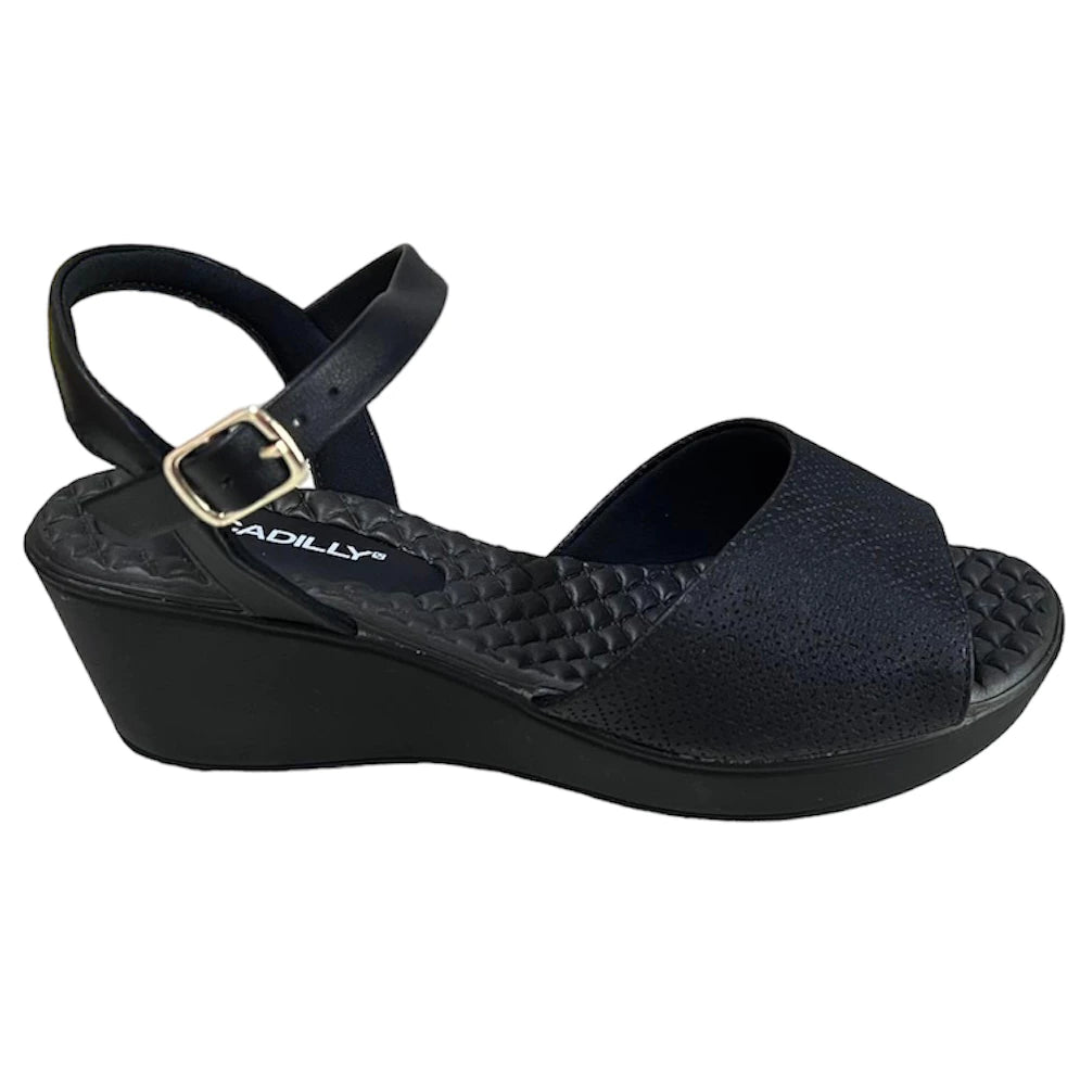 Piccadilly sandal with medium flat heel in black featuring a soft, cushioned insole. it has an adjustable buckle at the heel.