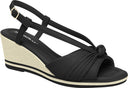 Black wedges sandal by Piccadilly featuring ab adjustable strap with a gold buckle, front knot detail, and a sole with  black and withe stripes.