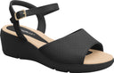 Flart-heeled Piccadilly sandal in black with a beige sole, adjustable buckle, and open upper.