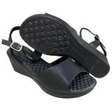 Piccadilly sandal with medium flat heel in black featuring a soft, cushioned insole. it has an adjustable  buckle at the heel.